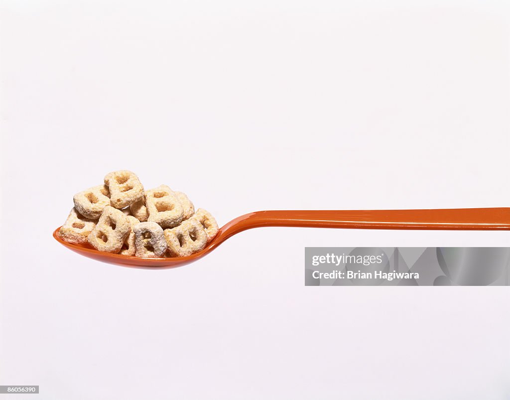 Spoon with cereal shaped like a "B