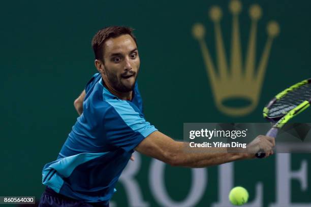 Viktor Troicki of Serbia returns a shot during the Men's singles match against John Isner of United States on day 5 of 2017 ATP Shanghai Rolex...