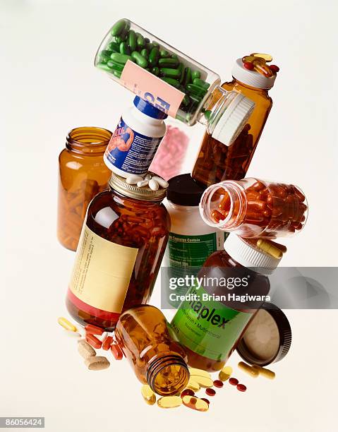pile of vitamins - nahrungsergänzungsmittel stock-fotos und bilder