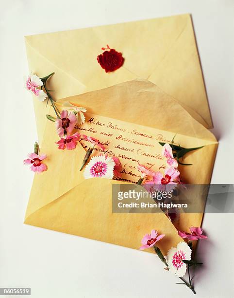love letter with flowers - love letter stock-fotos und bilder
