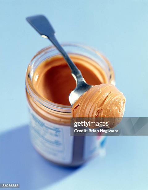 spoonful of peanut butter - pindakaas stockfoto's en -beelden