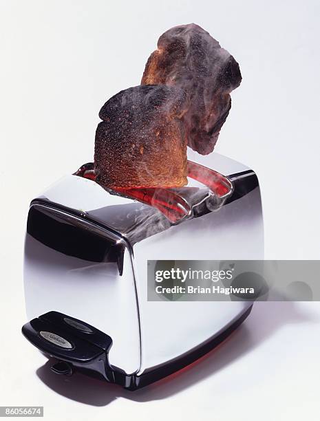 burnt toast popping out of toaster - burnt bread stock pictures, royalty-free photos & images