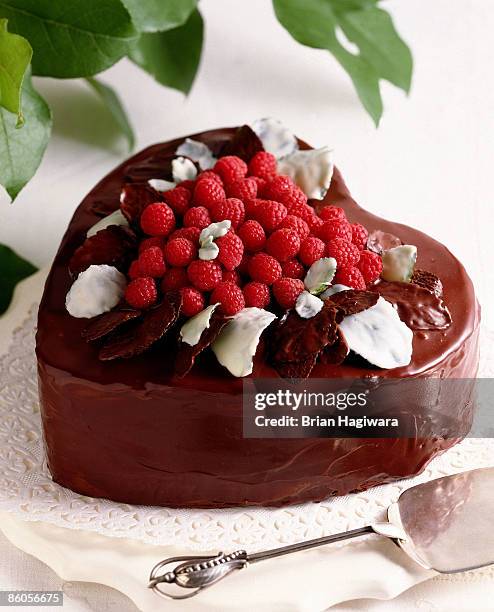 heart-shaped chocolate raspberry cake - heart shaped cake stock pictures, royalty-free photos & images