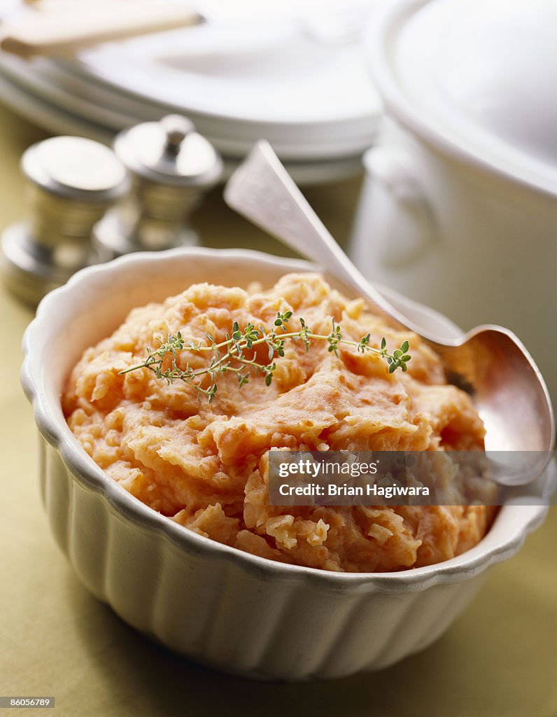 Mashed sweet potatoes garnished with thyme