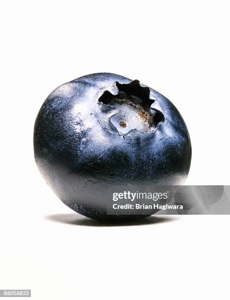 close-up of single blueberry - blueberry fruit stock pictures, royalty-free photos & images