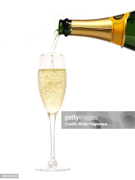 champagne pouring into glass - champagne stock pictures, royalty-free photos & images