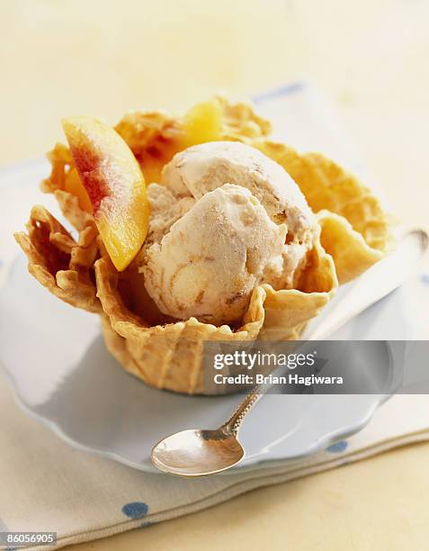 peach ice cream in waffle bowl - ice cream waffle bowls stock pictures, royalty-free photos & images