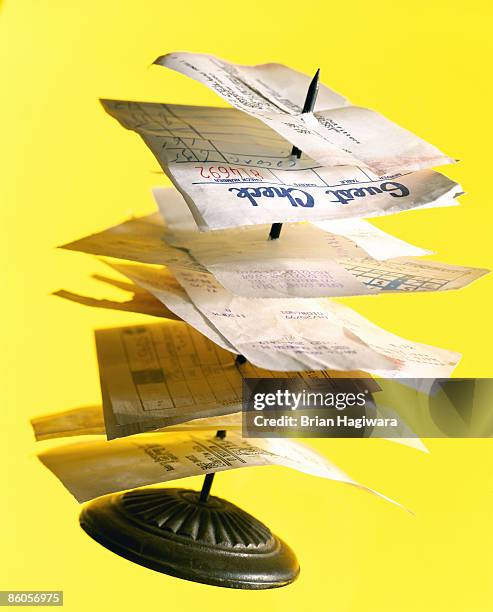 stack of receipts on restaurant spike - bill restaurant stock pictures, royalty-free photos & images