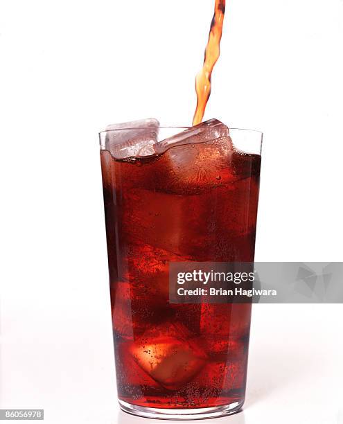 cola pouring into glass - root beer on white stock pictures, royalty-free photos & images