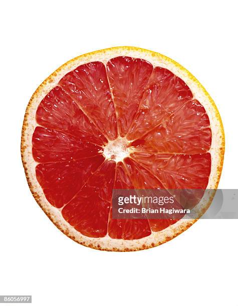 grapefruit slice - citrus fruit stock pictures, royalty-free photos & images
