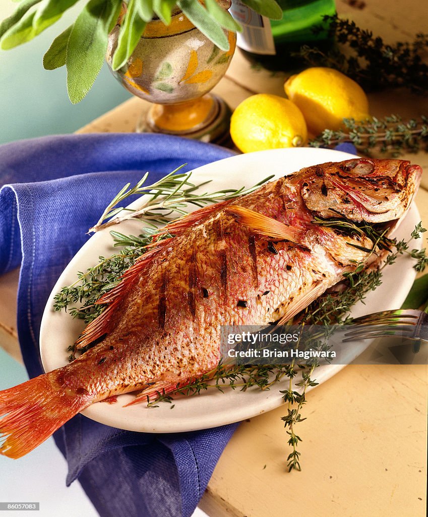 Grilled snapper stuffed with thyme and rosemary