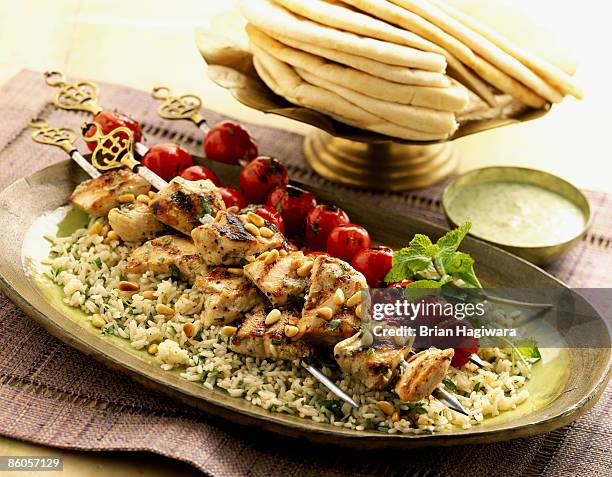 grilled chicken kabob over rice - middle eastern food stock pictures, royalty-free photos & images