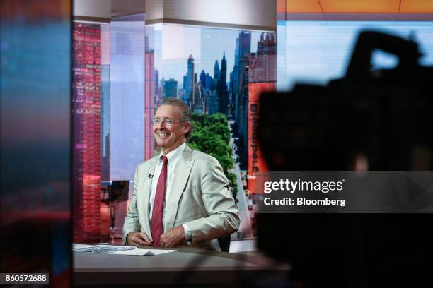 Charles Peabody, managing director of Compass Point Research & Trading LLC, smiles during a Bloomberg Television interview in New York, U.S., on...