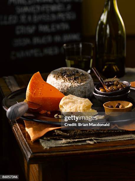 cheese plate - mimolette stock-fotos und bilder