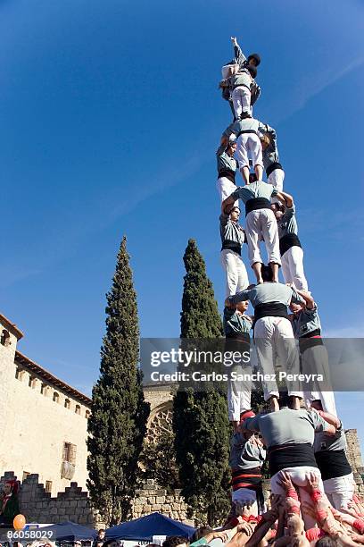 castellers in sant cugat del valles, barcelona, spain - human pyramid stock pictures, royalty-free photos & images