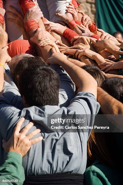 castellers in sant cugat del valles, barcelona, spain - castell stock pictures, royalty-free photos & images