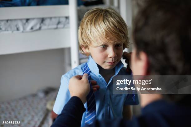 family getting ready for school in the morning - uniforme scolastica foto e immagini stock
