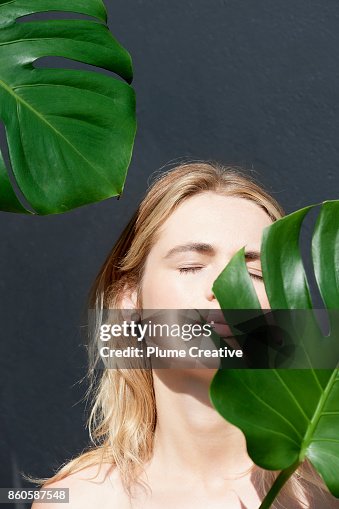 Woman with lush green foliage Woman with lush green foliage