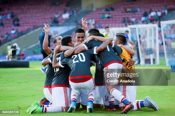 Paraguay's players celebrate a score during the FIFA U-17 World Cup match between Turkey and Paraguay in Mumbai, India on October 12, 2017.