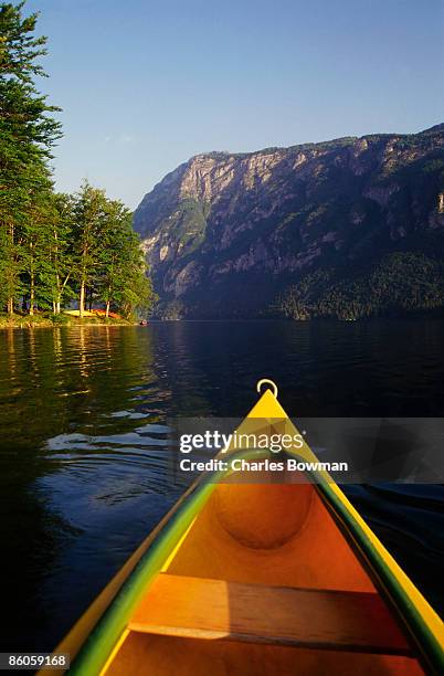 canoe in  lake bohinj - bowman lake stock pictures, royalty-free photos & images