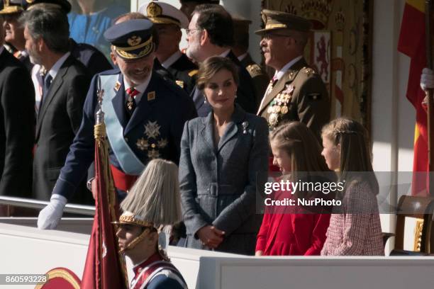 King Felipe VI of Spain, Queen Letizia of Spain, Princess Leonor of Spain and Princess Sofia of Spain attend the National Day Military Parade 2017 on...