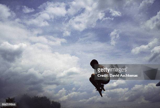 boy diving - david cannon stock pictures, royalty-free photos & images