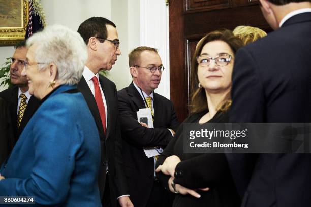 Mick Mulvaney, director of the Office of Management and Budget , center, speaks with Steven Mnuchin, U.S. Treasury secretary, left, before U.S....