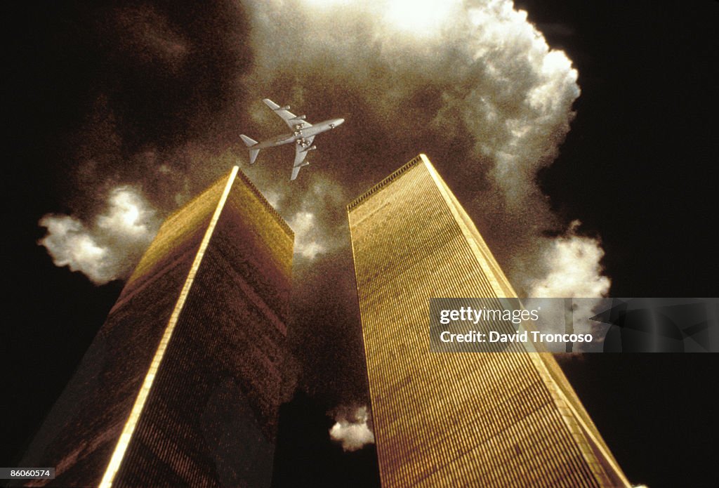 The twin towers with an airplane hovering above,  New York City