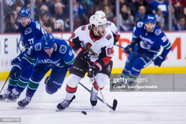 Vancouver Canucks Right Wing Derek Dorsett skates after Ottawa Senators Left Wing Mike Hoffman during a NHL hockey game on October 10 at Rogers Arena...