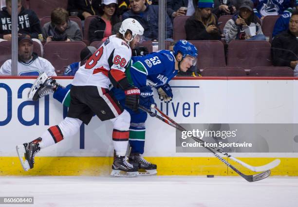 Ottawa Senators Left Wing Mike Hoffman checks Vancouver Canucks Center Bo Horvat during a NHL hockey game on October 10 at Rogers Arena in Vancouver,...