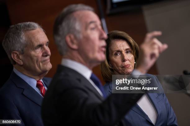 House Minority Leader Nancy Pelosi looks on as ranking member of the House Ways and Means Committee Rep. Richard Neal speaks during a news conference...