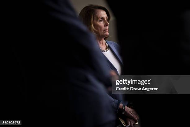 House Minority Leader Nancy Pelosi looks on a news conference on Republican plans to end the state and local tax deduction, on Capitol Hill, October...