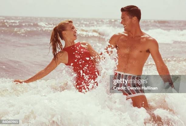 Playful Couple in Ocean Surf