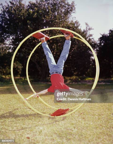 Boy Rolling in Giant Wheel Toy