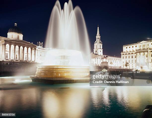 trafalgar square fountain at night, london, england - from the archives london by night stock pictures, royalty-free photos & images