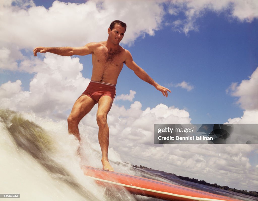 Man Riding Surf Board