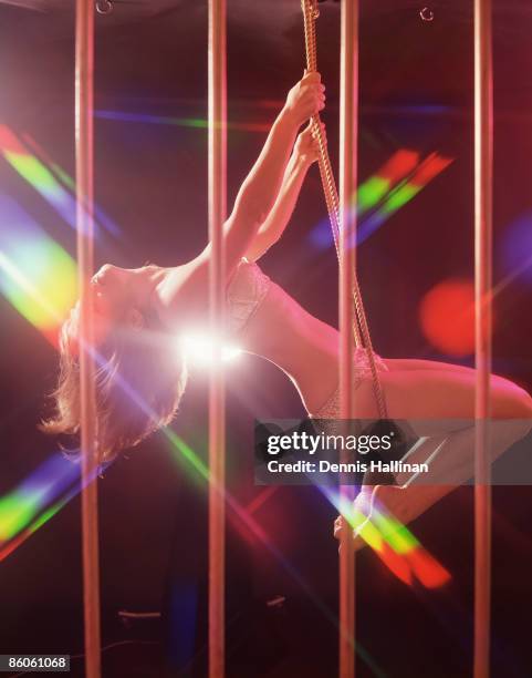 Go-go Dancer on a Swing Inside Cage