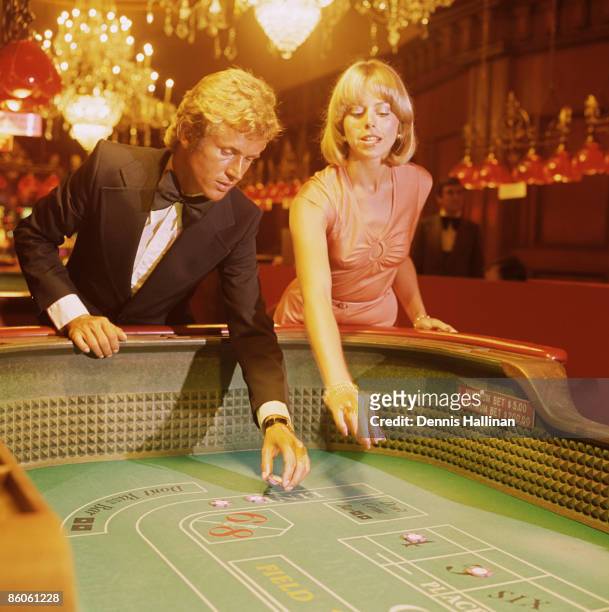 Elegant Couple Gambling at Craps Table