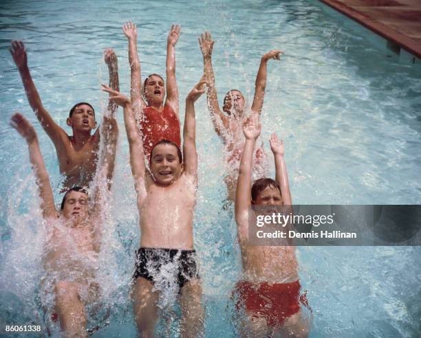 Children splashing in swimming pool