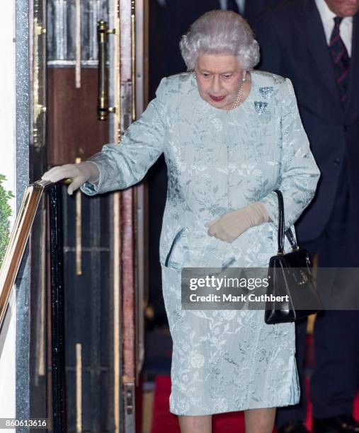 Queen Elizabeth II leaves after a reception to mark the Centenary of the Women's Royal Navy Service and the Women's Auxiliary Army Corp at The Army &...