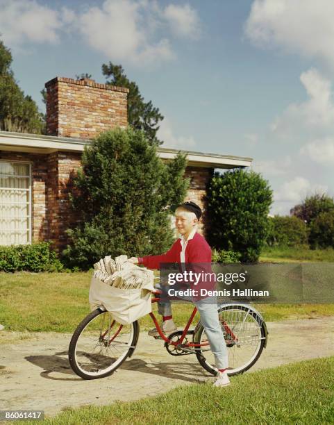 Paperboy Delivers Newspapers on Bicycle