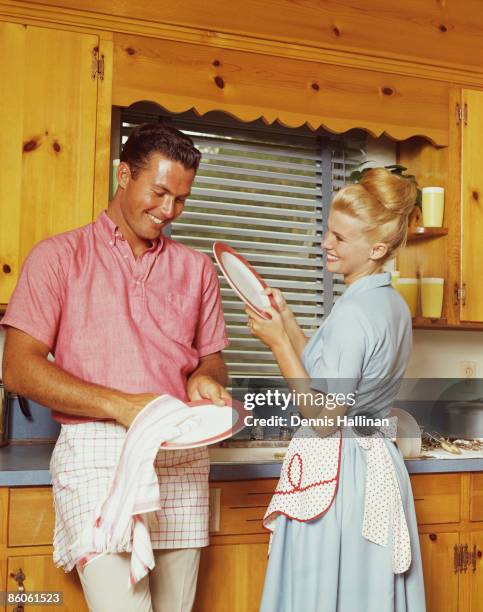 Couple washing dishes