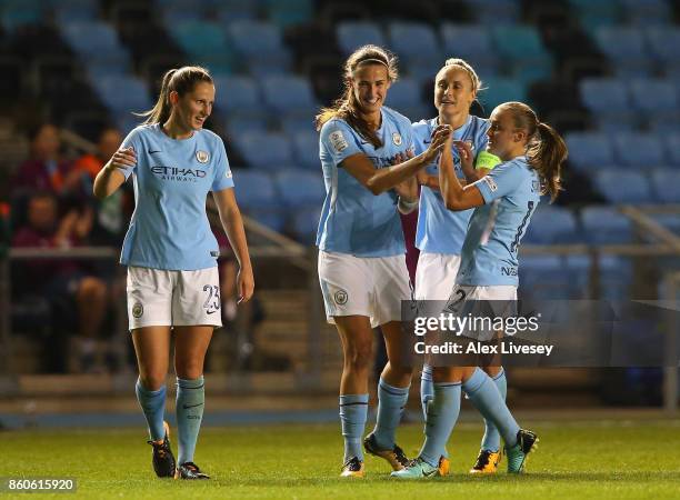 Jill Scott of Manchester City celebrates with team mates after scoring their second goal during the UEFA Women's Champions League match between...