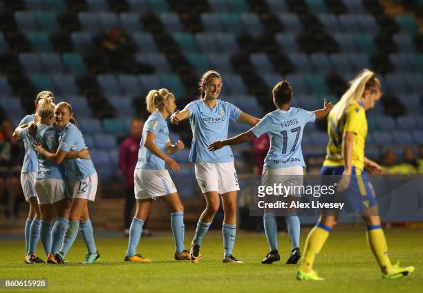 Jill Scott of Manchester City celebrates with Nikita Parris after scoring their second goal during the UEFA Women's Champions League match between...