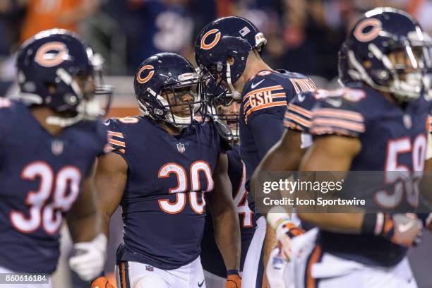 Chicago Bears running back Benny Cunningham and Chicago Bears punter Pat O'Donnell celebrate a Cunningham touchdown reception on a pass thrown by...
