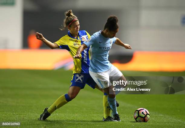 Demi Stokes of Manchester City Ladies holds off a challenge from Nadine Prohaska of St. Polten Ladies during the UEFA Women's Champions League match...