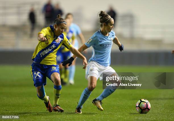 Jane Ross of Manchester City Ladies holds off a challenge from Julia Tabotta of St. Polten Ladies during the UEFA Women's Champions League match...