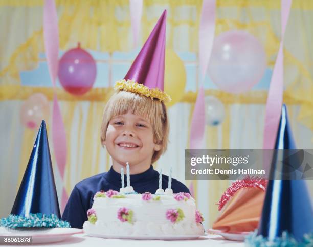 Smiling boy with birthday cake