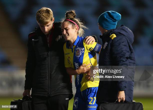 Jasmin Eder of St. Polten Ladies is helped off injured during the UEFA Women's Champions League match between Manchester City Ladies and St. Polten...