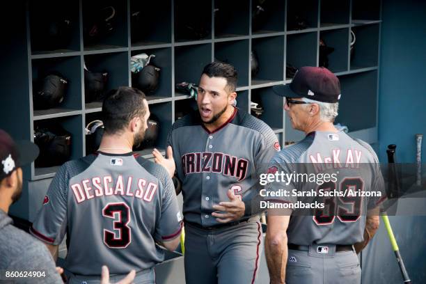 David Peralta of the Arizona Diamondbacks gets energized with teammate Daniel Descalso prior to Game Two of the National League Division Series...